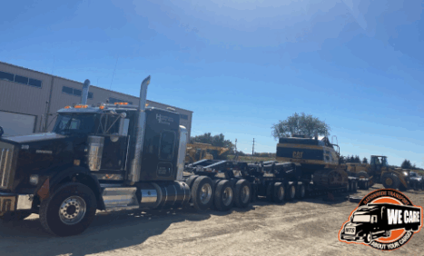 CAT excavator loaded for transport