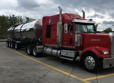 Power carrier’s red tractor truck ready for power-only freight hauling.