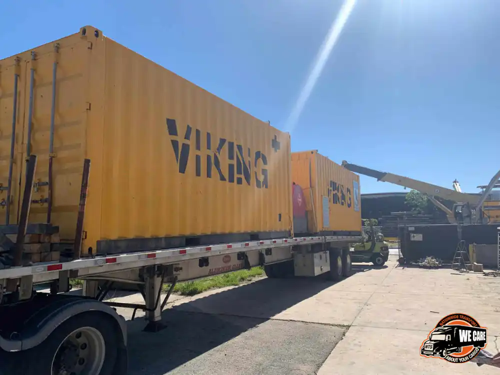two yellow loading containers