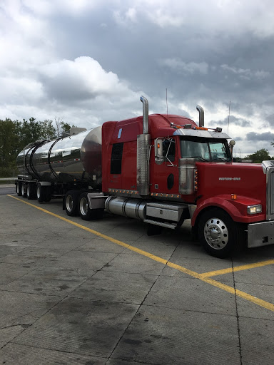 Power carrier’s red tractor truck ready for power-only freight hauling.