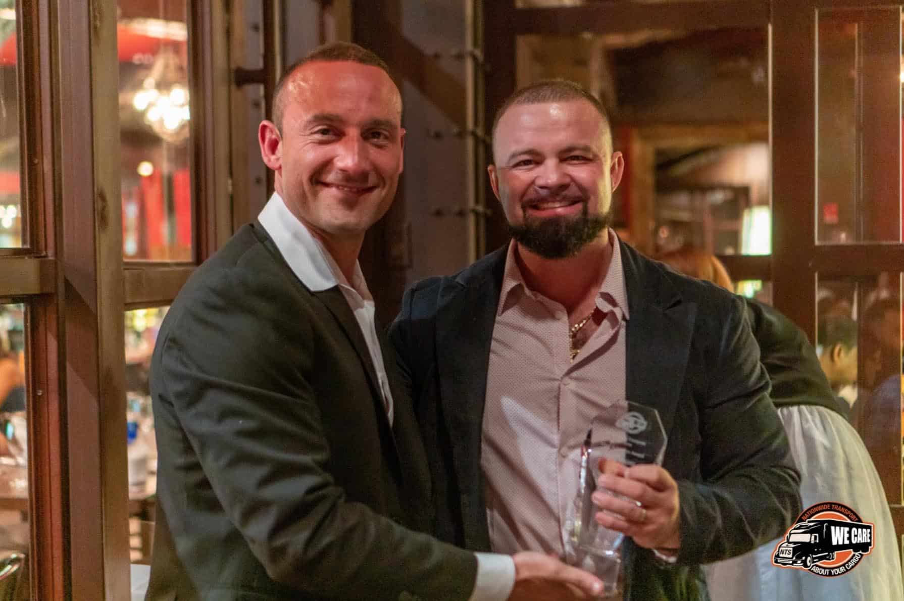 Posing with Team Member Award