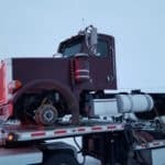 red truck being towed