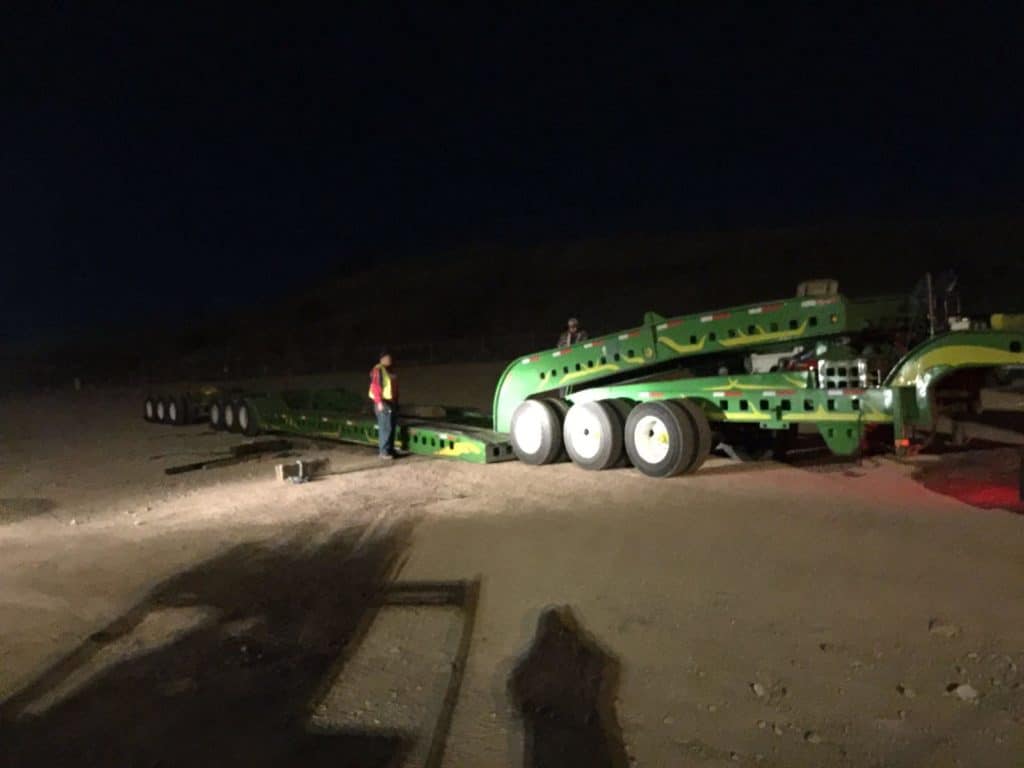green trailer unloading