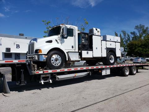 white truck being towed